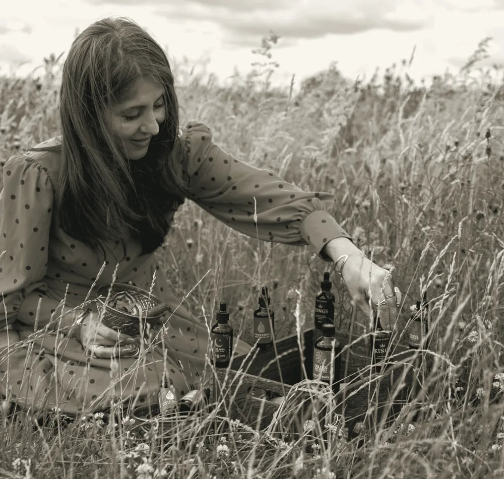 Samina gathering the oils in a wildflower meadow