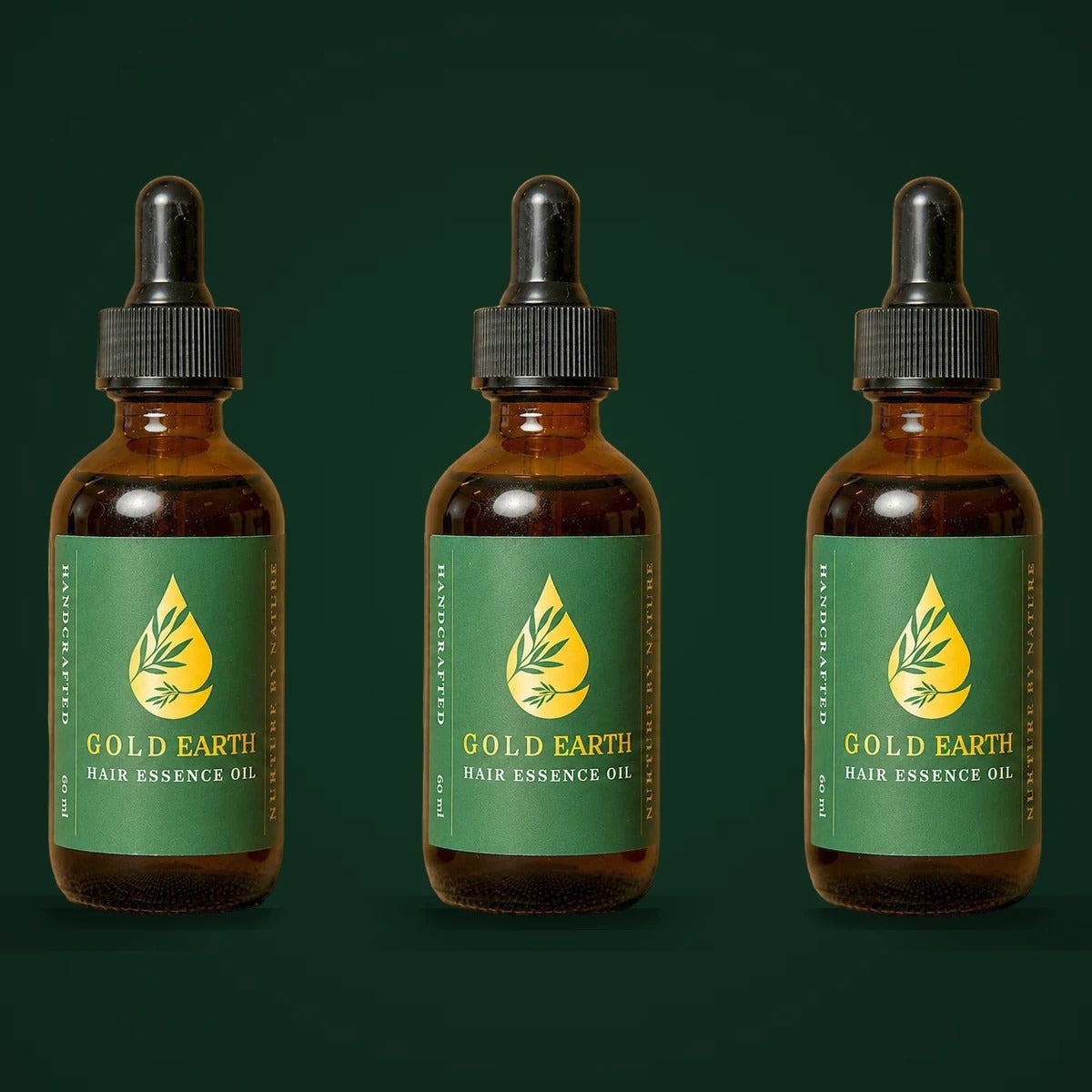 Gold Earth Hair Essence Trio — three bottles of rosemary hair oil