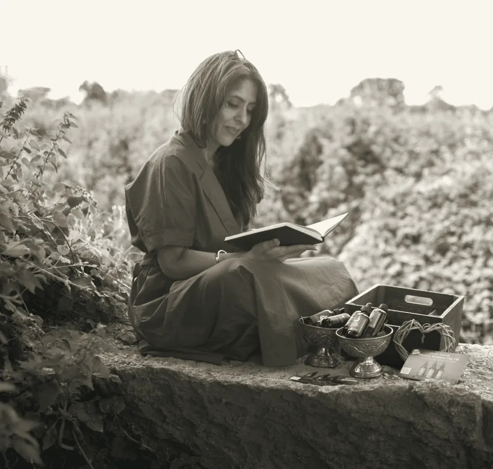 Samina reading beside her botanical oils
